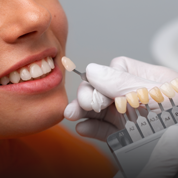 dentist examining patient teeth with mouth mirror
